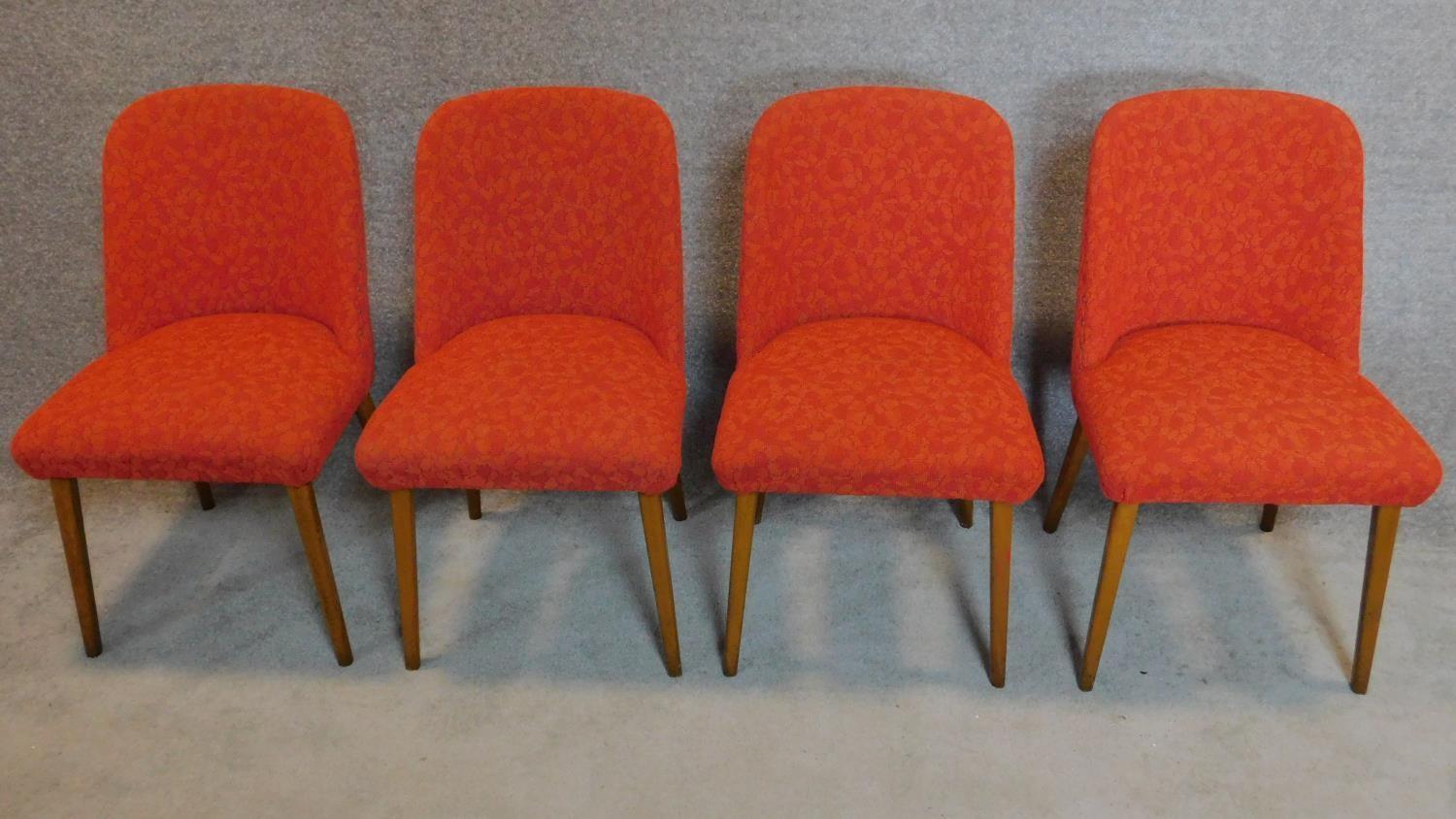 A set of four mid 20th century beech tub chairs in cut moquette upholstery. H.80cm