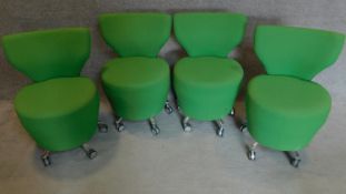 A set of four orangebox low chairs on casters. H.81cm