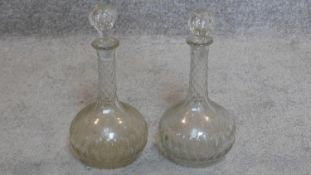 A pair of 19th century cut and etched glass decanters. H.32cm