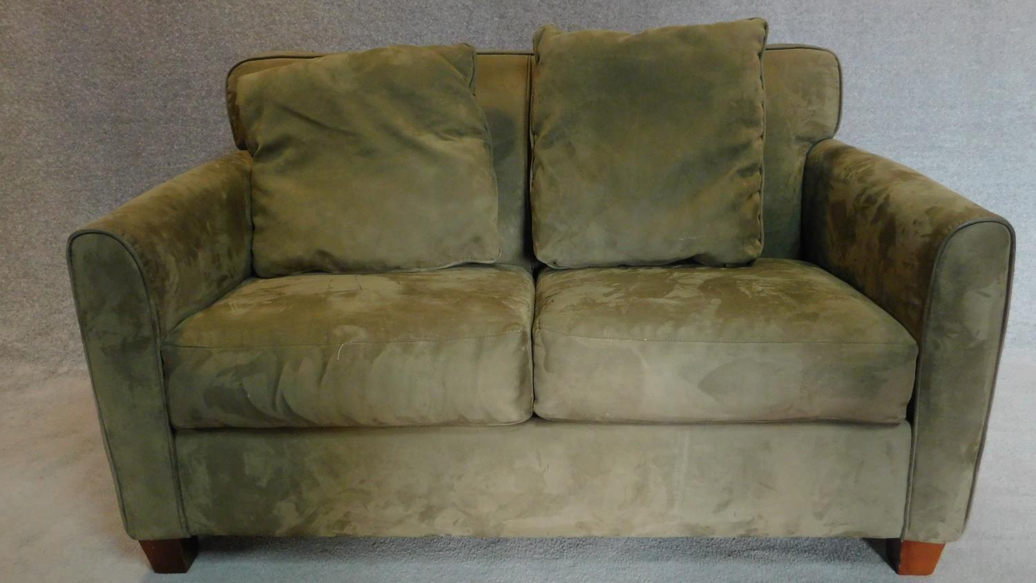 A 2 seater sofa in sage faux suede upholstery. 88x145x93cm - Image 2 of 3
