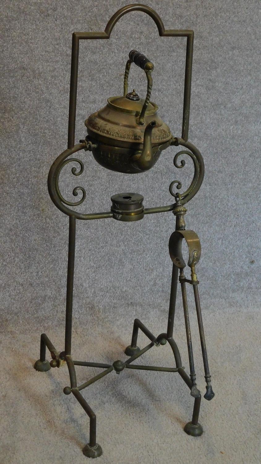 A late Victorian brass kettle and burner on stand with tongs. H.82 (stand)