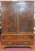 A Georgian mahogany linen press fitted slides over two short and one long drawer. 124x125x47cm