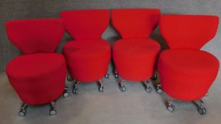 A set of four orangebox low chairs on casters. H.81cm