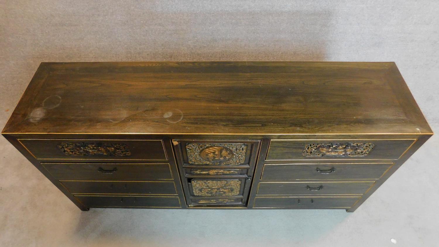 A lacquered and carved Chinese sideboard fitted central cupboard flanked by drawers. 90x180x45cm - Image 6 of 10