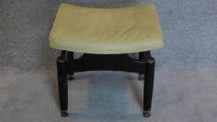 A vintage E. Gomme G-Plan dressing stool. (some damage to covering) 44x50x41cm.