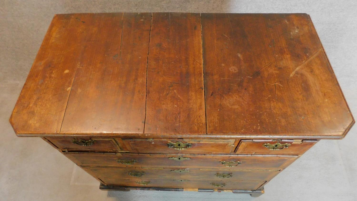 A mid Georgian walnut and featherbanded chest of three short over three long drawers. - Image 6 of 8