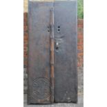 A pair of antique carved doors from the Kafiristan region of Afghanistan. 215x100cm