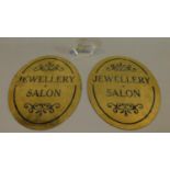 A pair of brass jewellery shop signs and a Moser glass shop display sign. 40x27.5cm