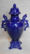 A blue glazed lidded twin handled urn of shaped bulbous form. H.65cm
