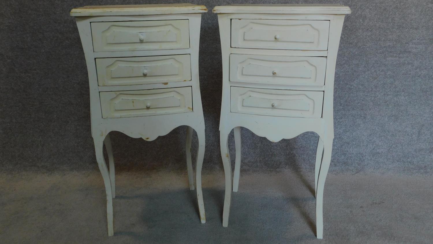 A pair of French style white painted three drawer small chests. 80x42x33cm
