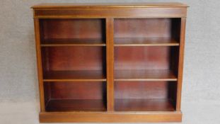 A mahogany and satinwood inlaid open bookcase. 100x124x32cm