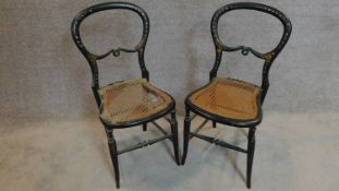 A pair of late Victorian ebonised and mother of pearl inlaid balloon back bedroom chairs. H.83cm