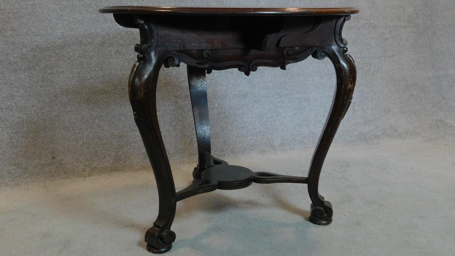 A 19th century Continental carved oak swivel action trefoil flap centre table. 74x82x82cm - Image 2 of 7