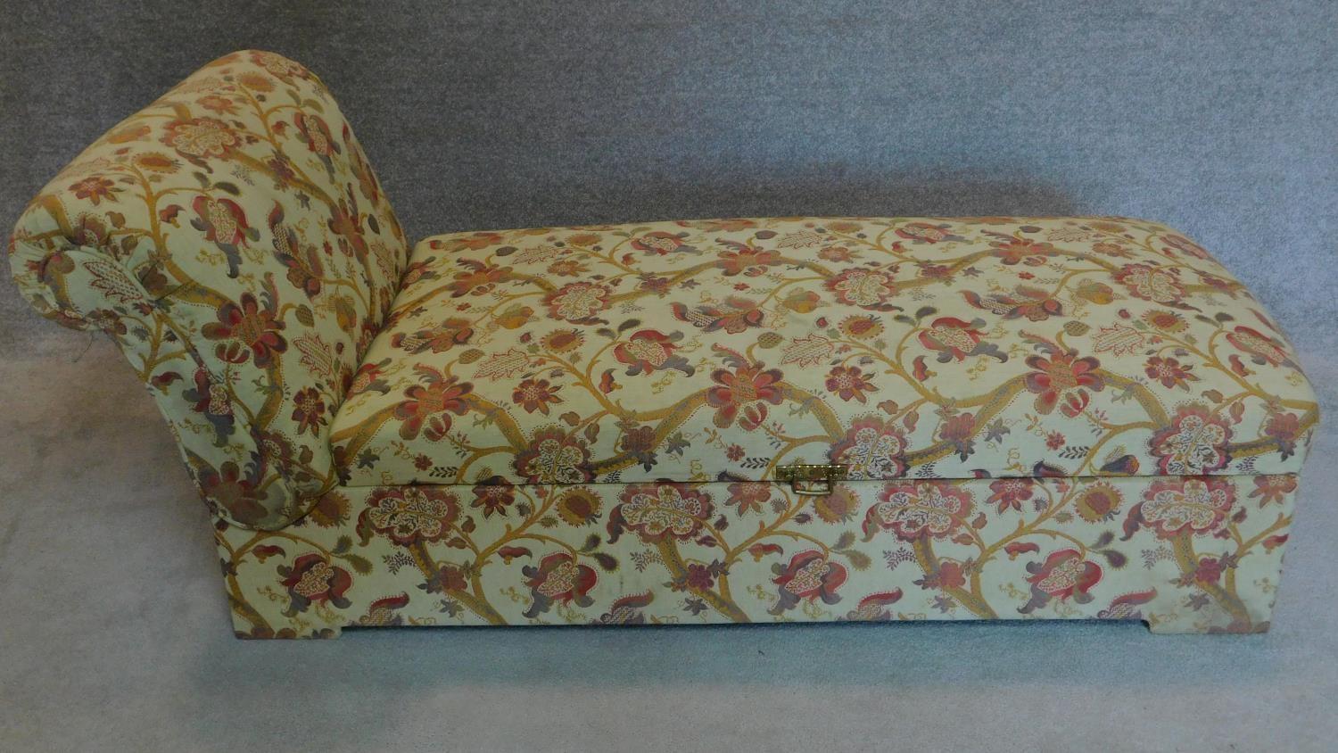 An Edwardian floral upholstered ottoman or day bed with adjustable reclining action. 40x185x68cm