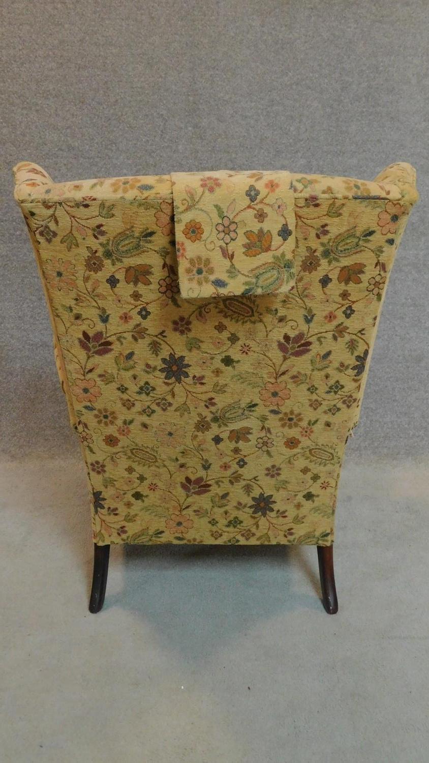 A Georgian style Parker Knoll wingback armchair in floral tapestry upholstery. H.96cm - Image 3 of 8