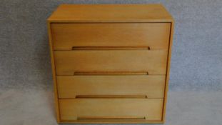 A small oak 4 drawer chest by Stag furniture. 77x76x46cm