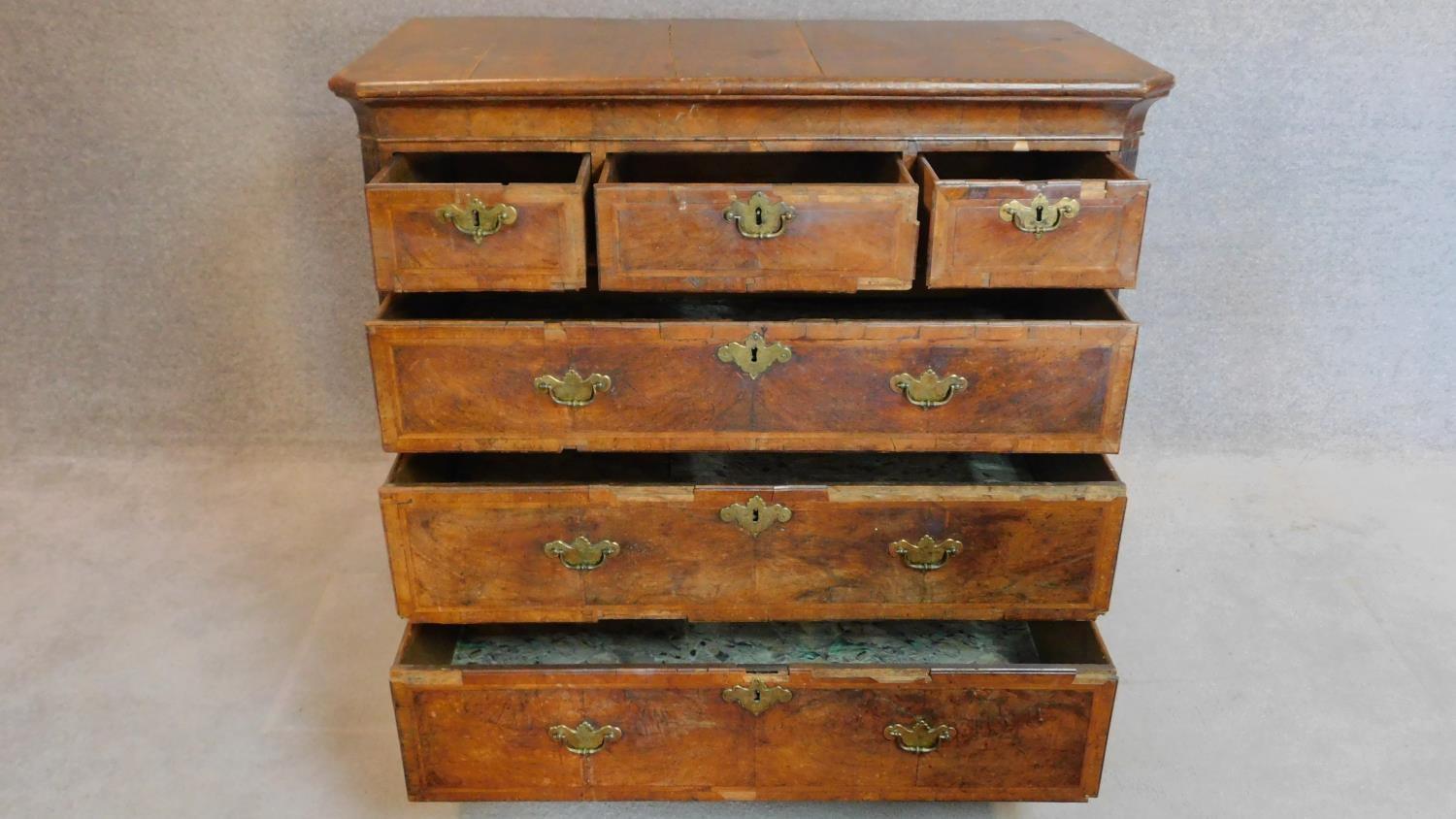 A mid Georgian walnut and featherbanded chest of three short over three long drawers. - Image 2 of 8