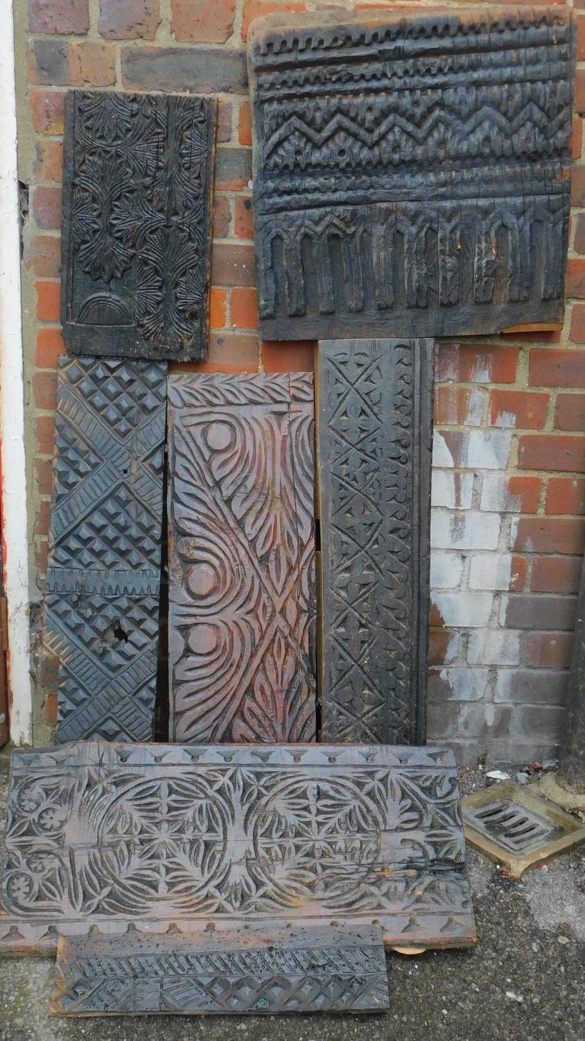 A collection of seven antique carved panels from the Kafiristan region of Afghanistan. 72x33cm (