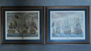 A large pair of framed and glazed prints of fighting galleons. 70x80cm