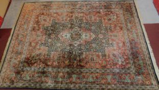A large Persian style Heriz rug, the central double pendant medallion with repeating petal motifs,