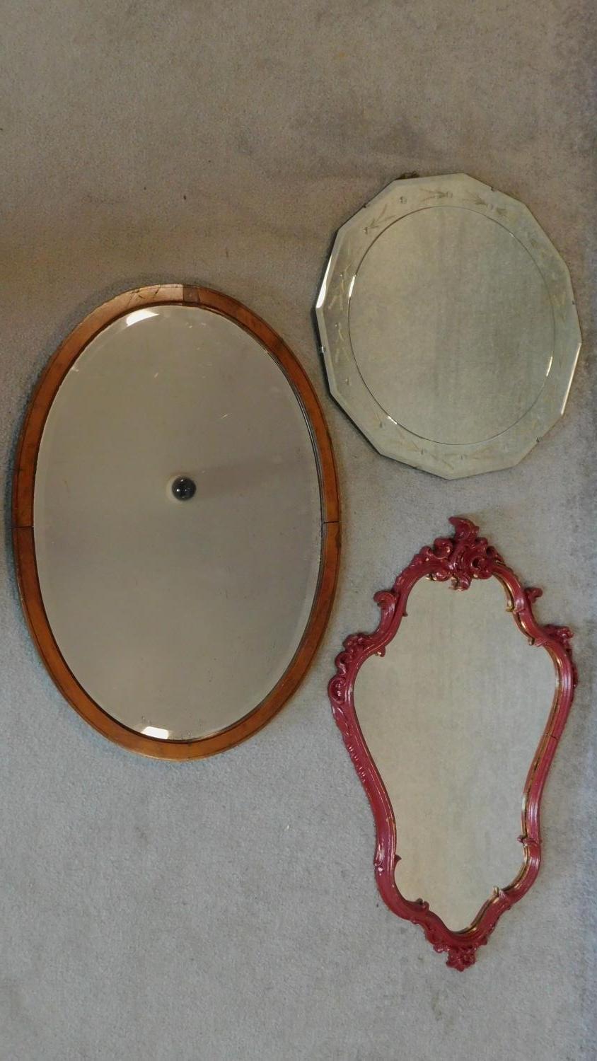 A mid 20th century etched circular wall mirror, an Edwardian mahogany mirror and another. 53x72cm (