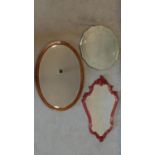 A mid 20th century etched circular wall mirror, an Edwardian mahogany mirror and another. 53x72cm (