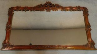 A Victorian style carved mahogany overmantel mirror. 87x140cm