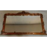 A Victorian style carved mahogany overmantel mirror. 87x140cm