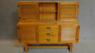 A rustic pine two section kitchen dresser. 117x136x42cm