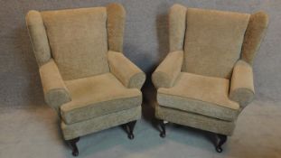 A pair of beige upholstered armchairs with moulded faux mahogany cabriole supports. H.102cm