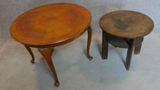 A circular occasional table on cabriole supports and another similar. 69x90cm