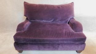 A Victorian style 2 seater sofa upholstered in purple velvet, makers label: Bernhardt. 80x145x100cm