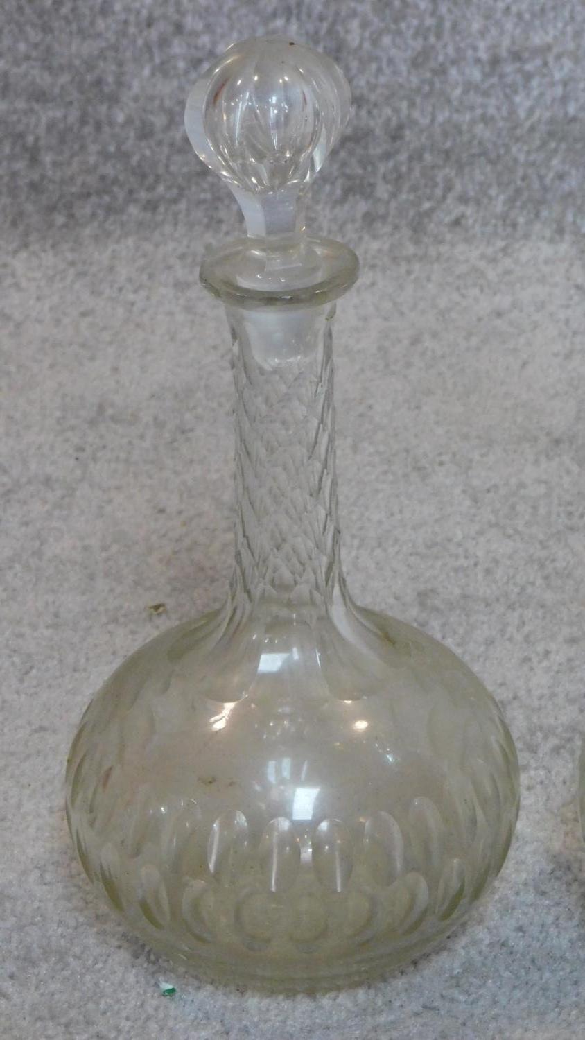 A pair of 19th century cut and etched glass decanters. H.32cm - Image 2 of 4