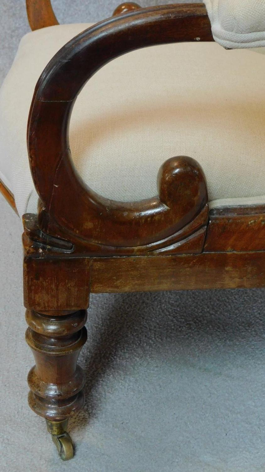 A Victorian mahogany framed buttoned back upholstered easy chair on turned tapering supports. H.91cm - Image 4 of 5