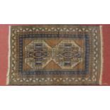 A Belouch rug with central double pole medallion set on a blue, ivory and yellow field with
