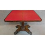 A Regency rosewood foldover top card table with baize lined interior on well carved pedestal and