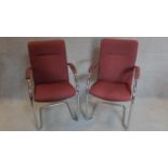 A pair of chrome framed boardroom chairs. H.94cm
