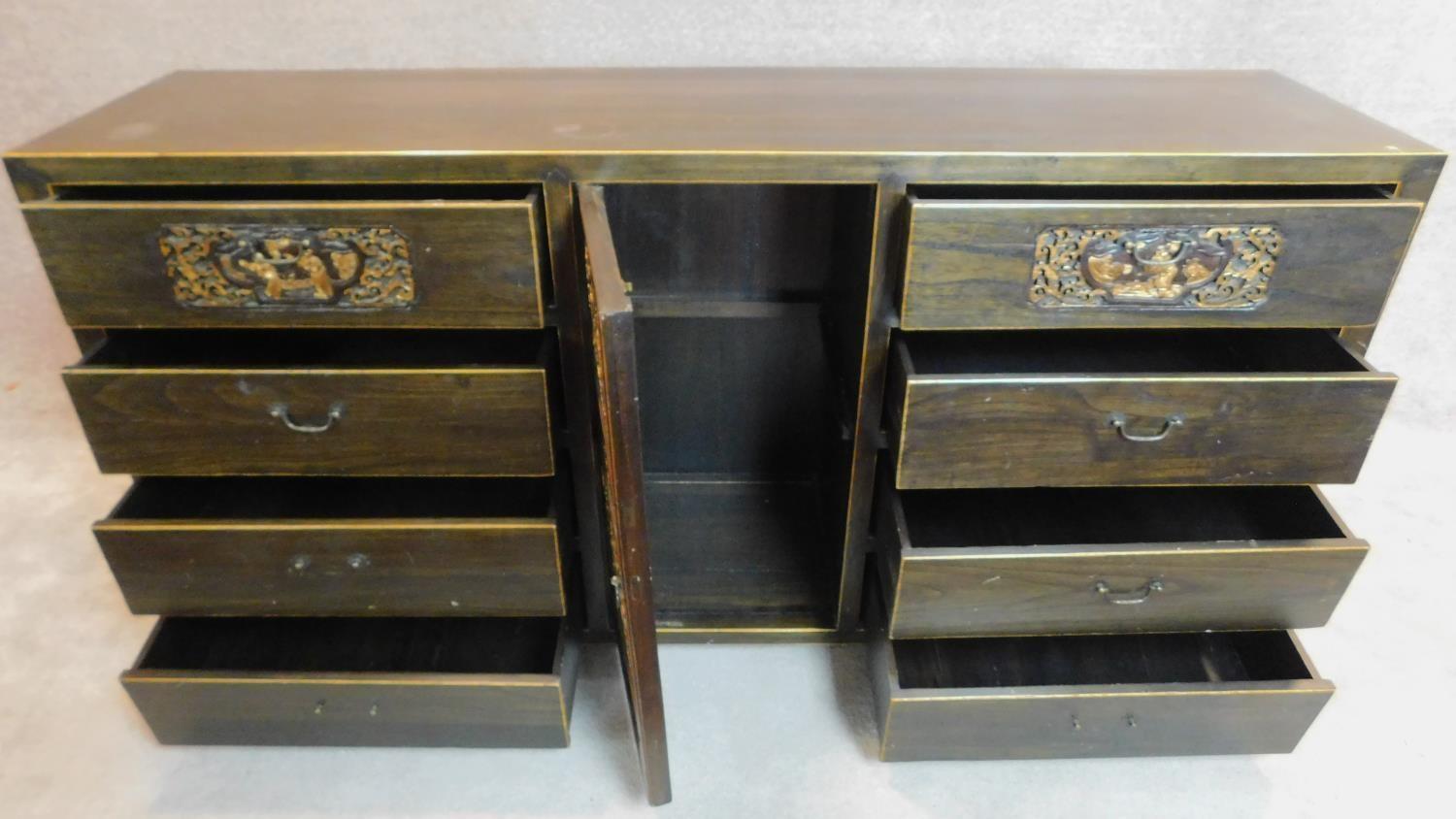 A lacquered and carved Chinese sideboard fitted central cupboard flanked by drawers. 90x180x45cm - Image 3 of 10