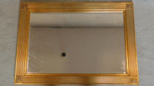 A rectangular gilt and reeded framed pier mirror. 109x79cm