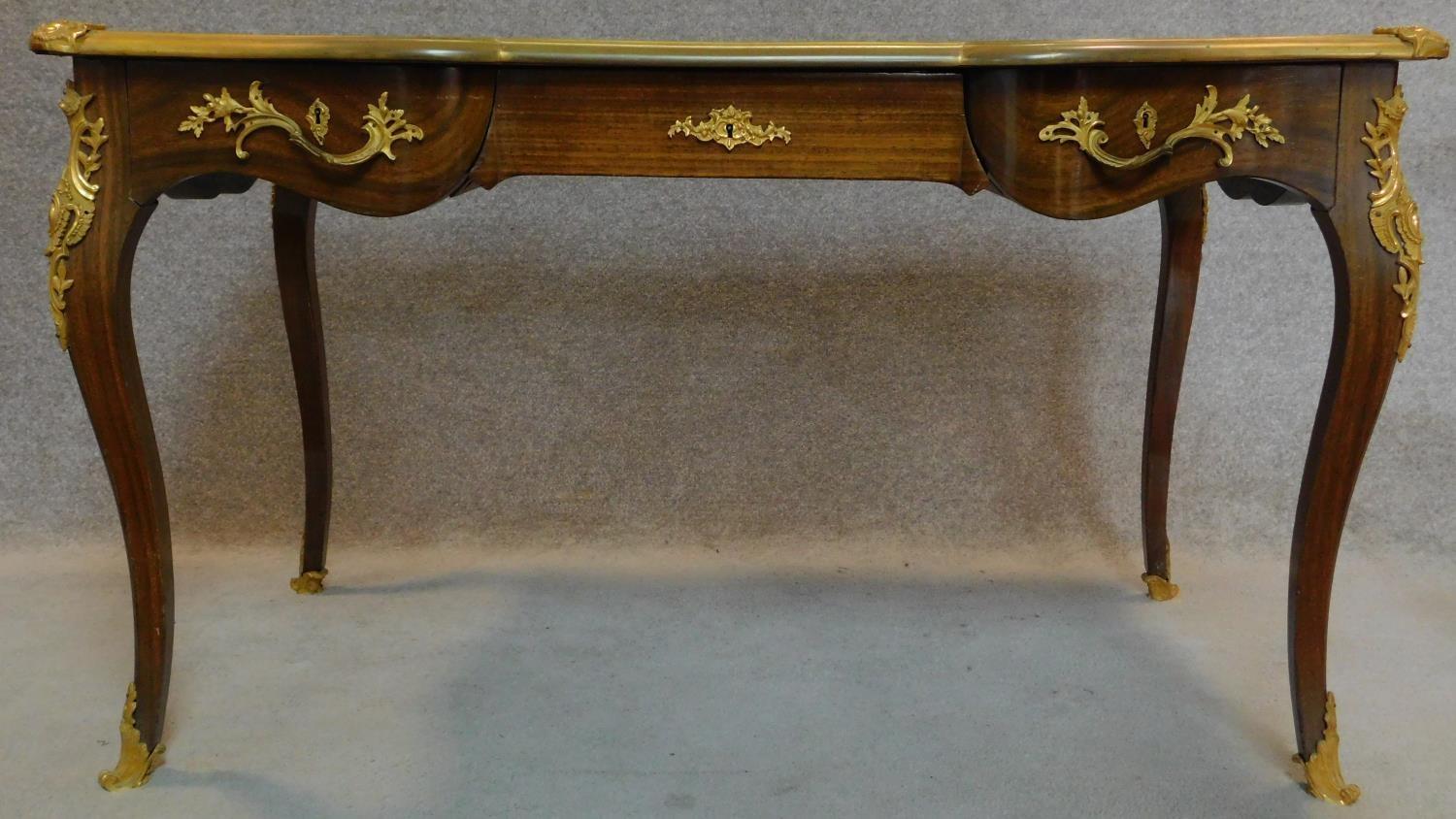 A walnut Louis XV style bureau plat of compact size with shaped tooled leather inset top with ormolu - Image 2 of 12