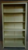A painted full height open bookcase. 177x95x30cm