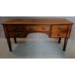 An early 19th century mahogany writing table with satinwood and ebony lined top on spiral reeded