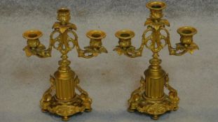 A pair of 19th century Empire style gilt metal three branch candelabra. H.29cm