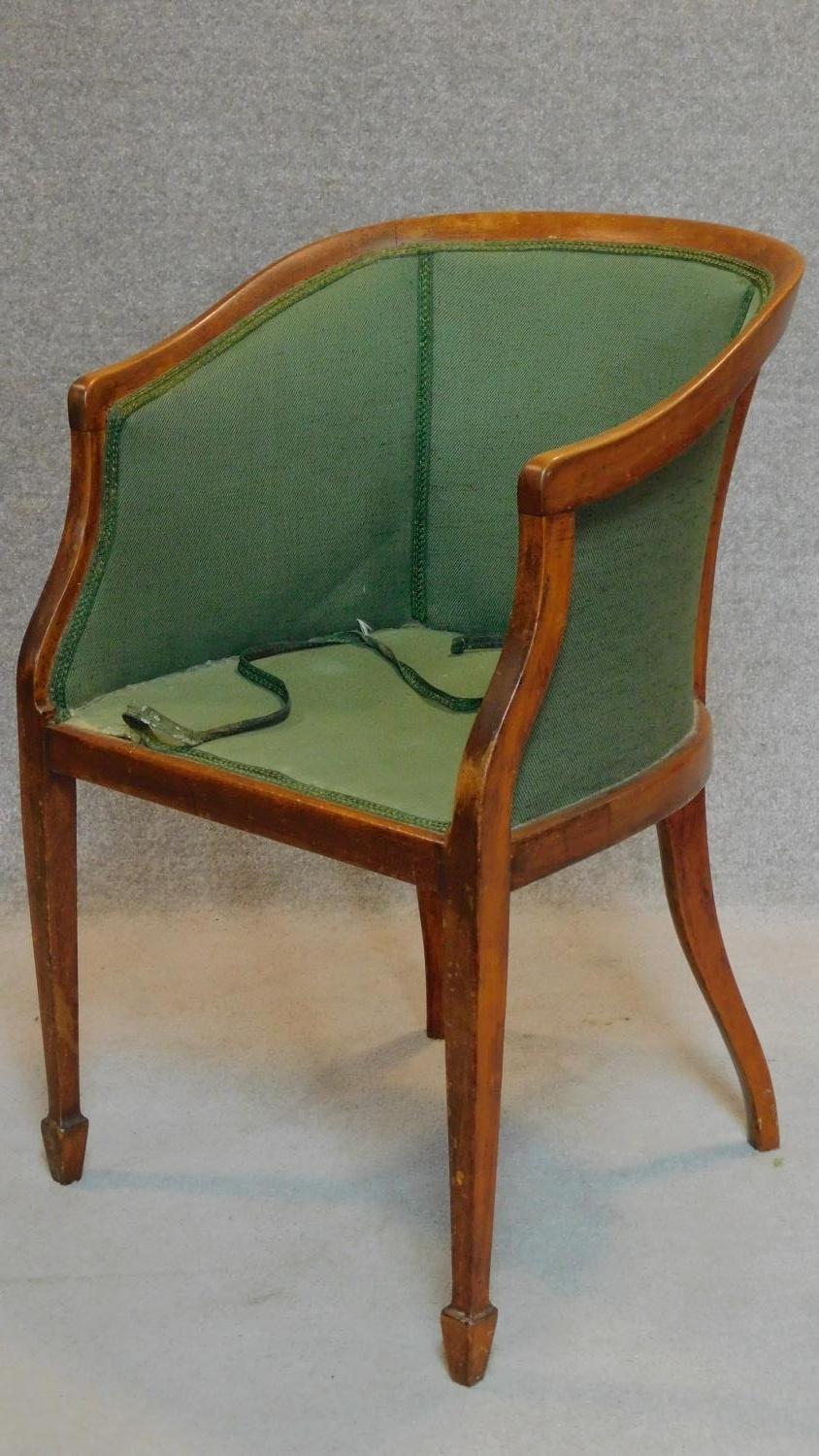 An early 20th century beech framed tub armchair. H.81cm