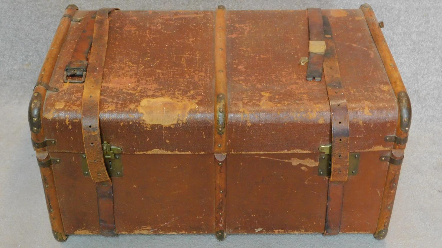 A vintage travelling trunk. H.44 W.84 D.54cm