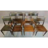 A set of eight 1970's vintage teak designer armchairs fitted brass caps and rails. H.85cm