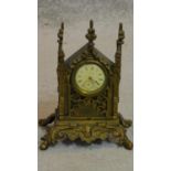 A small 19th century gothic inspired mantel clock. H.17cm (lacks pendulum)