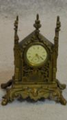 A small 19th century gothic inspired mantel clock. H.17cm (lacks pendulum)