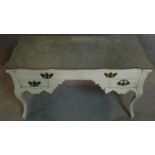 A white painted French style bureau plat with shaped glass top. 71x121x55cm