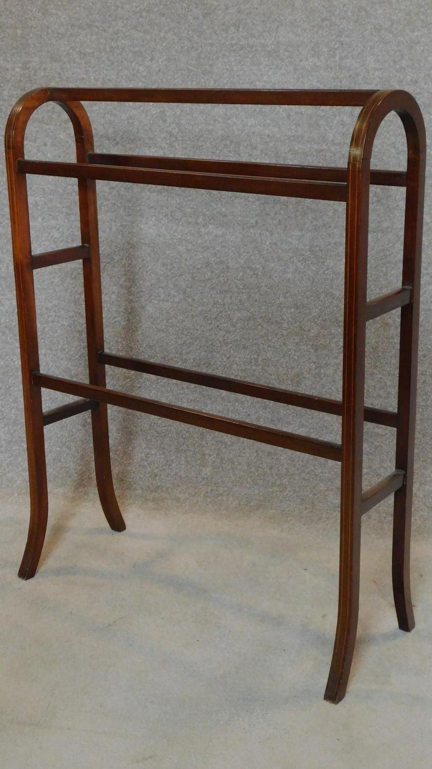 An Edwardian mahogany and satinwood inlaid towel rail. H.93 W.71 D.28cm